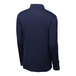 A back view of a navy long sleeve Sport-Tek polo shirt on a mannequin.