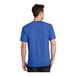 A man wearing a Port & Company royal blue short sleeve t-shirt.