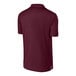 A maroon Sport-Tek polo shirt.