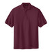 A Port Authority burgundy polo shirt.