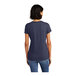 A woman wearing a heathered navy blue District short sleeve t-shirt.