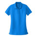 A blue Port Authority women's short sleeve polo shirt.