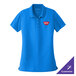 A true royal blue Port Authority women's polo shirt with a logo on it.