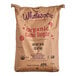 A brown bag of Wholesome Sweeteners Organic Cane Sugar with text on it.