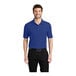 A man wearing a Port Authority® royal blue polo shirt.
