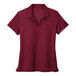 A red Nike Dri-Fit short sleeve polo with a black Nike swoosh.