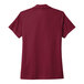 A red Nike polo shirt.