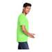 A man wearing a neon green Port & Company short sleeve T-shirt.
