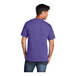 A man wearing a purple Port & Company short sleeve T-shirt.