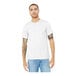 A man wearing a Bella + Canvas white ring-spun cotton/poly blend t-shirt.