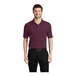 A man wearing a maroon Port Authority® Silk Touch™ Pique Polo Shirt.