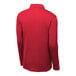 A red Sport-Tek long sleeve polo shirt on a mannequin.