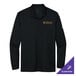 A black Nike long sleeve Dri-FIT polo shirt with a logo on the counter.