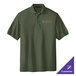 A Port Authority clover green polo shirt with a logo on it.