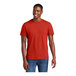 A man wearing a District® Fiery Red combed ring-spun cotton T-shirt.