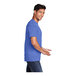 A man wearing a Port & Company heather royal blue t-shirt.