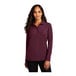 A woman wearing a Port Authority burgundy long sleeve polo shirt.
