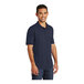 A man wearing a Port & Company deep navy short sleeve polo shirt.
