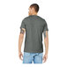 A man wearing a Bella + Canvas deep heather grey customizable t-shirt.