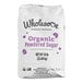 A white bag of Wholesome Sweeteners organic powdered sugar with purple text.