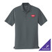 A graphite Port Authority short sleeve polo shirt with a logo on it.