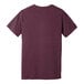 The back of a Bella + Canvas heather maroon t-shirt with a small logo on the front.