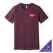A maroon Bella Canvas t-shirt with a logo on it.