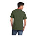 A man wearing a Port & Company olive drab green heather short sleeve t-shirt.