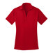 A red Port Authority women's polo shirt with a collar.