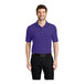 A man wearing a purple Port Authority® silk touch polo shirt.