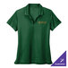 A women's green Nike polo shirt with a logo on it.