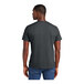 A man wearing a District charcoal short sleeve t-shirt.