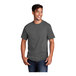 A man smiling and wearing a Port & Company charcoal short sleeve t-shirt.