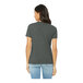 A woman wearing a Bella + Canvas deep heather grey customizable t-shirt.