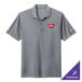 A Nike cool gray polo shirt with a red logo.