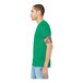 A man with tattoos wearing a heather green Bella + Canvas short sleeve t-shirt.