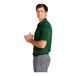 A man in a green Nike Dri-Fit polo shirt.