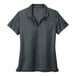 A grey Nike polo shirt with a black Nike swoosh on it.