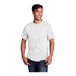 A man wearing a white Port & Company short sleeve t-shirt.