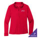 A red long sleeve Port Authority polo shirt with an embroidered logo.