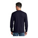 A man wearing a Port & Company navy long sleeve t-shirt.