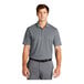 A man wearing a Nike grey Dri-Fit polo with a collar.