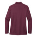 A Port Authority women's long sleeve silk touch pique polo shirt in burgundy.