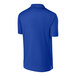 A back view of a blue Sport-Tek polo shirt.