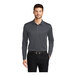 A man wearing a Port Authority steel gray long sleeve polo shirt.