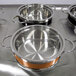 A Bon Chef Classic Country French steam table pot on a table.