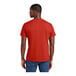 A man wearing a District Fiery Red short sleeve t-shirt.