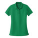 A Port Authority women's bright Kelly green short sleeve polo shirt.