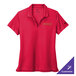 A University Red Nike women's performance polo shirt with a logo on it.