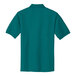 The back of a teal green Port Authority polo shirt.